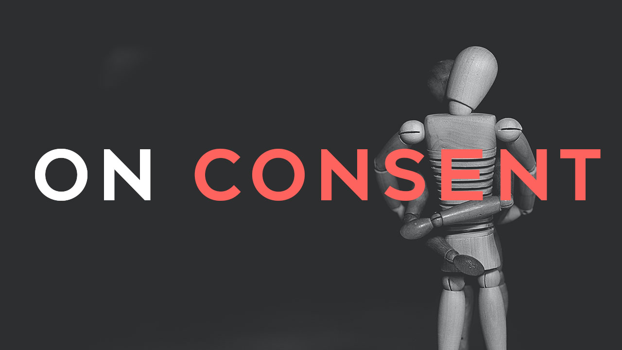 two mannequines in embrace with the words on consent written over them